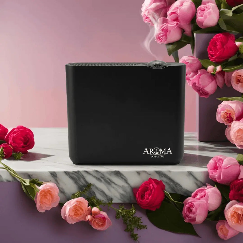 Zwarte AromaDiffusing Smart tussen roze bloemen